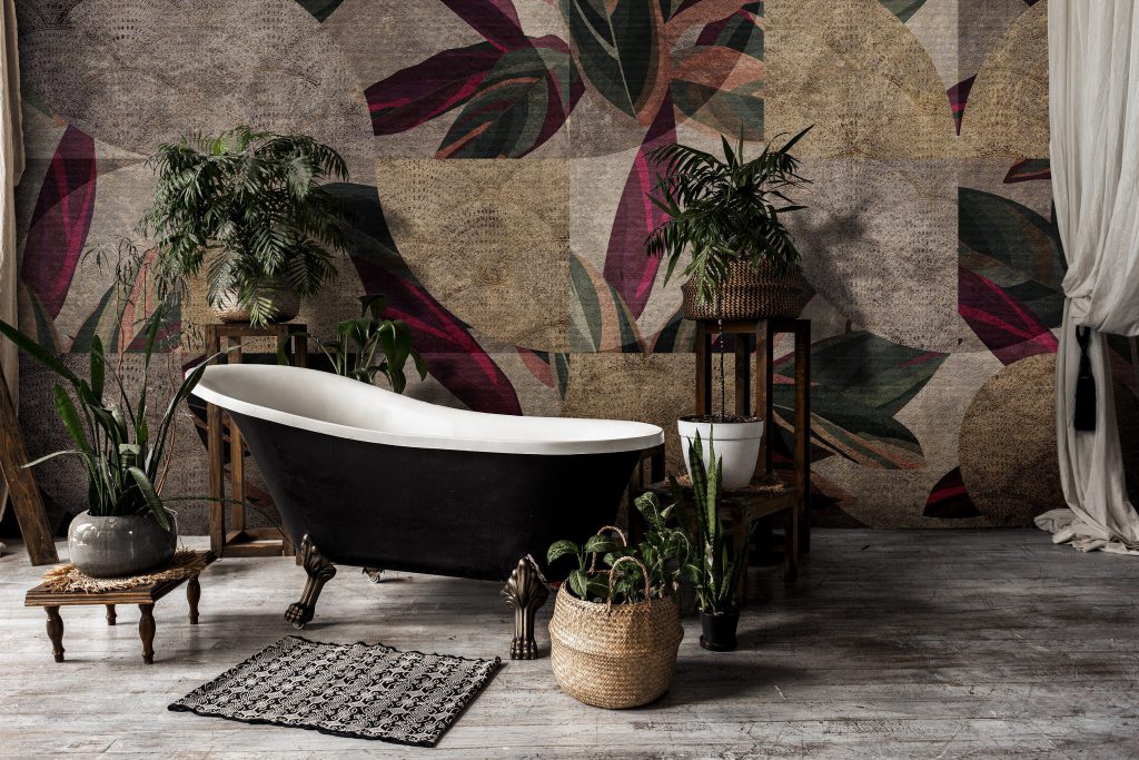 Bathroom in vintage style with elegant interior, contemporary black tub, textile carpet, green plants in flower pots, mirror and copy space on white wall